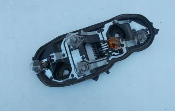 Opel Corsa D Tail light bulb cover holder 89037852