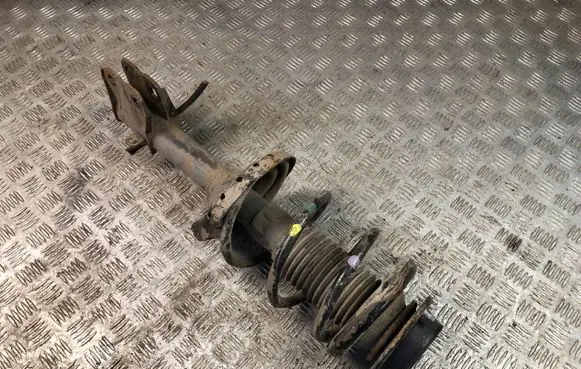 Subaru Outback Front shock absorber with coil spring
