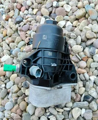 Volkswagen Touran III Oil filter mounting bracket 03N115389T