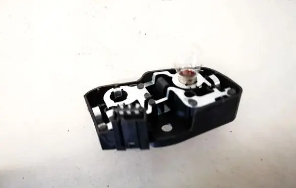 Tail light bulb cover holder