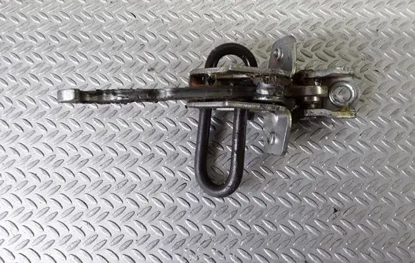 Front door check strap stopper