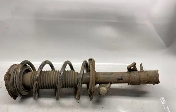 Nissan X-Trail T31 Front shock absorber with coil spring