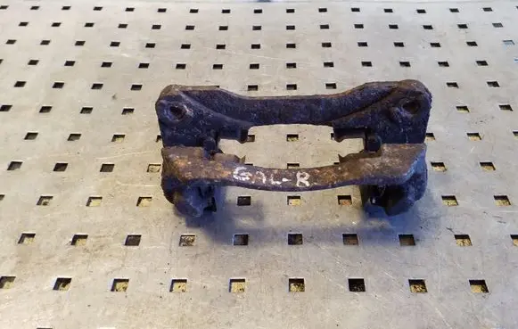 Subaru Legacy Brake caliper pad carrier rear 