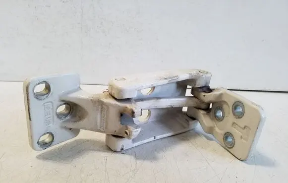 Loading door lower hinge