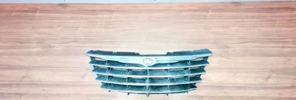 Chrysler Grand Voyager IV Front bumper upper radiator grill OWY46TRMA 04857802AB 04857986AB