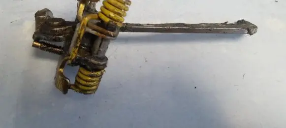 Front door check strap stopper