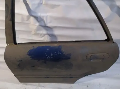 Mazda 323 F Rear door melynos
